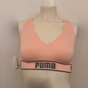 2-medium PUMA work-out tops that are new.  Have not been worn.  White&Corral.